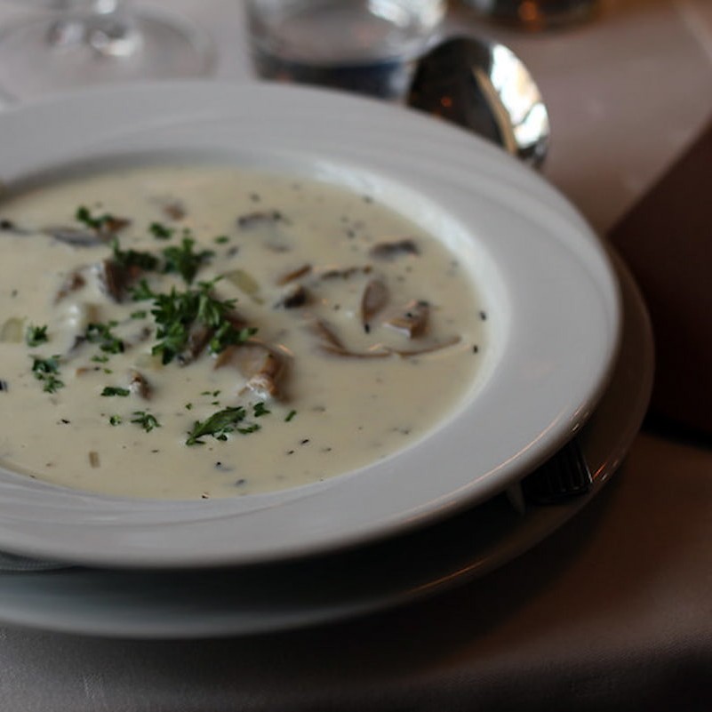 Delicious Cream of Mushroom soup in a white bowl